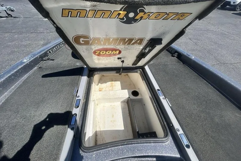 Slide: The Image of Open storage compartment on a 2007 Ranger Z20 boat with Minn Kota branding. - 10