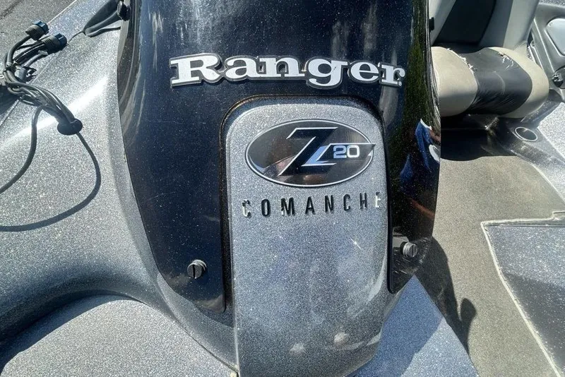 Slide: The Image of 2007 Ranger Z20 Comanche boat engine cover with logo and branding details. - 18