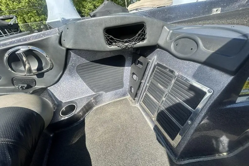 Slide: The Image of Interior of a 2007 Ranger Z20 boat showing storage compartments and seating area. - 20