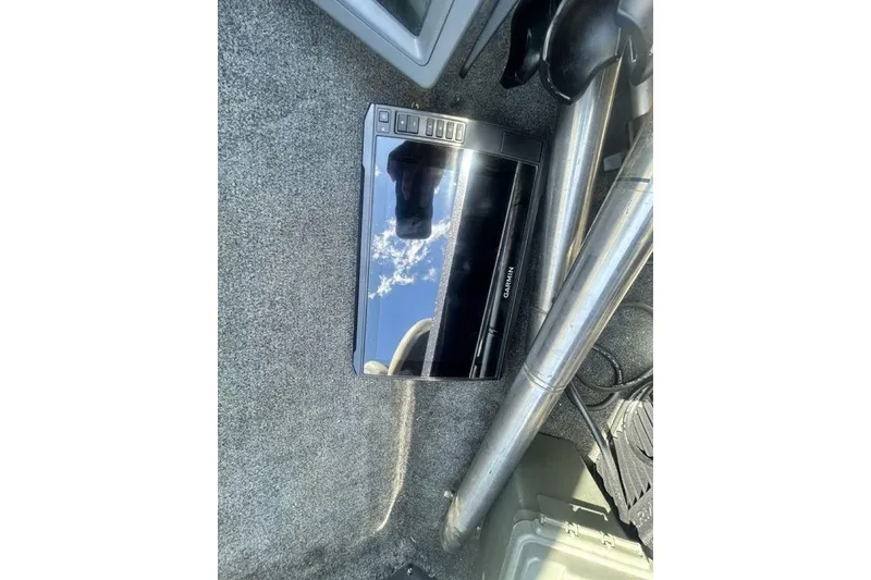 Slide: The Image of Garmin device on 2007 Ranger Z20 boat carpeted floor, reflecting sky. - 9