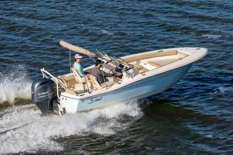 Slide: The Image of Manufacturer Provided Image: 2024 Scout 195 Sport Dorado boat cruising on water. - 11