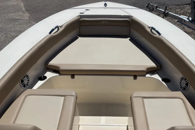 Slide: The Image of 2024 Scout 195 Sport Dorado boat interior with beige seating and cup holders. - 7