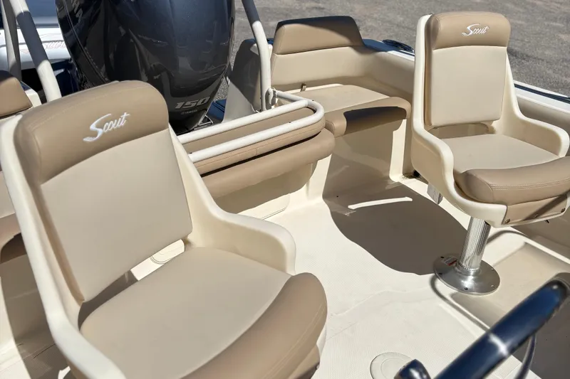 Slide: The Image of 2024 Scout 195 Sport Dorado boat interior with beige seating and Yamaha engine. - 9