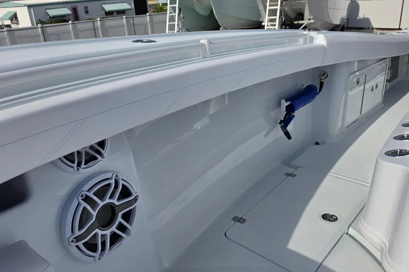 Slide: The Image of 2026 Yellowfin 36 Offshore boat interior with speakers and storage compartments. - 11