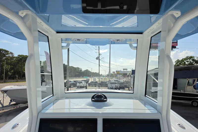 Slide: The Image of Interior view of 2026 Yellowfin 36 Offshore boat, showcasing helm and windshield. - 15