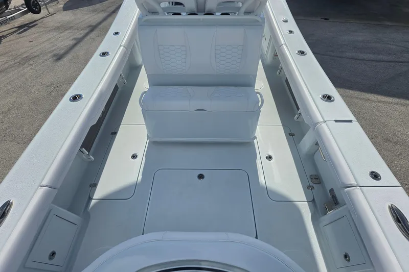 Slide: The Image of 2026 Yellowfin 36 Offshore boat interior with white seating and spacious deck layout. - 18
