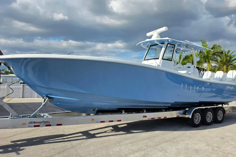 Slide: The Image of 2026 Yellowfin 36 Offshore boat on trailer under cloudy sky. - 4