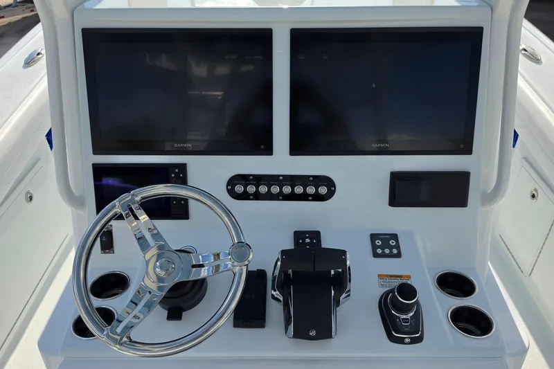 Slide: The Image of Helm of 2026 Yellowfin 36 Offshore boat with dual Garmin displays and modern controls. - 5
