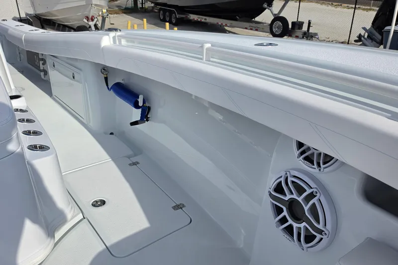 Slide: The Image of 2026 Yellowfin 36 Offshore boat interior with speakers and rod holders. - 8