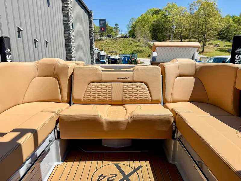 Slide: The Image of Interior of a 2024 MasterCraft X24 boat with beige seating. - 20