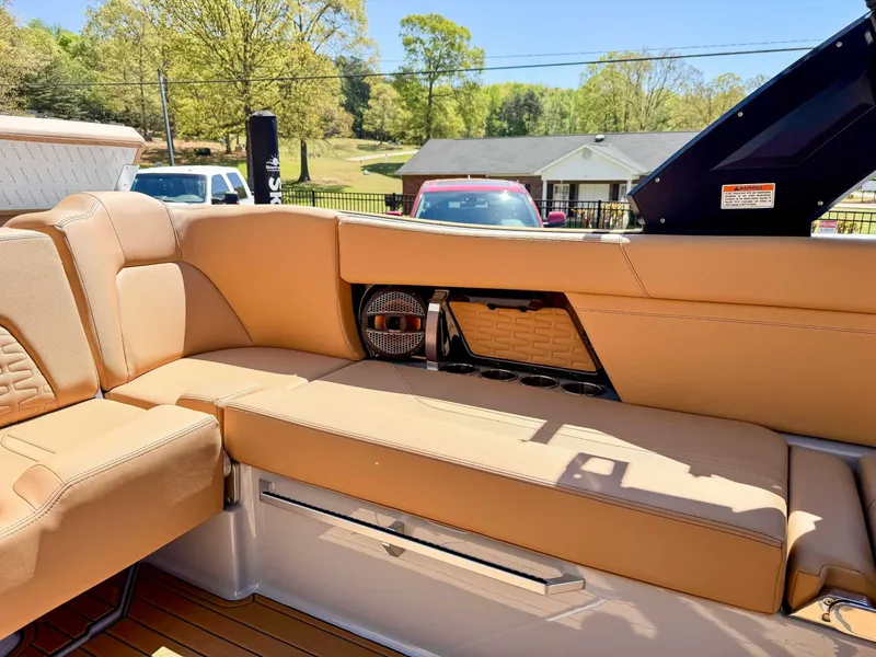 Slide: The Image of Interior of 2024 MasterCraft X24 with beige seating and speaker. - 21