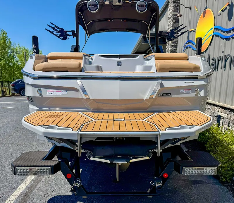 Slide: The Image of Rear view of 2024 MasterCraft X24 boat at dock. - 8