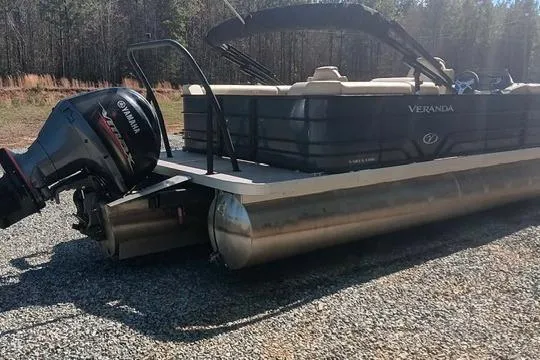 Slide: The Image of 2023 Veranda Vista View 22RC pontoon boat with Yamaha motor outdoors. - 9