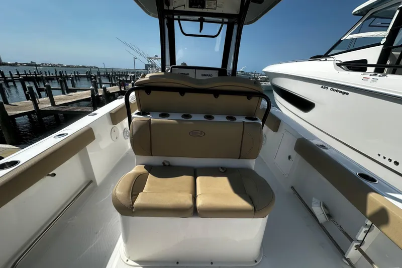 Slide: The Image of 2018 Sea Hunt Gamefish 27 boat interior with forward seating, docked at marina. - 6