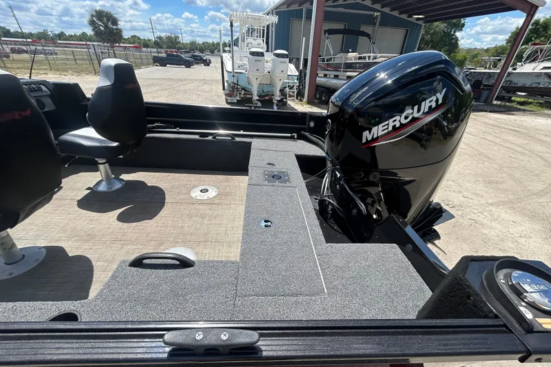 Slide: The Image of 2023 Competitor 165 SC boat with Mercury engine, featuring spacious seating and storage. - 10