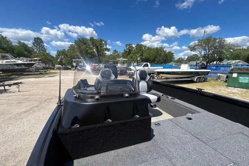 Slide: The Image of 2023 Competitor 165 SC boat in outdoor lot, surrounded by other boats and vehicles. - 3