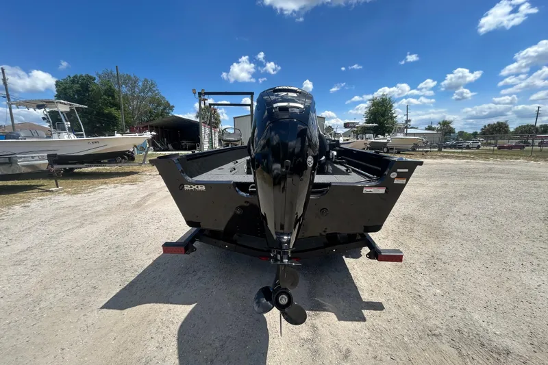 Slide: The Image of Rear view of 2023 Competitor 165 SC boat with outboard motor on a sunny day. - 9