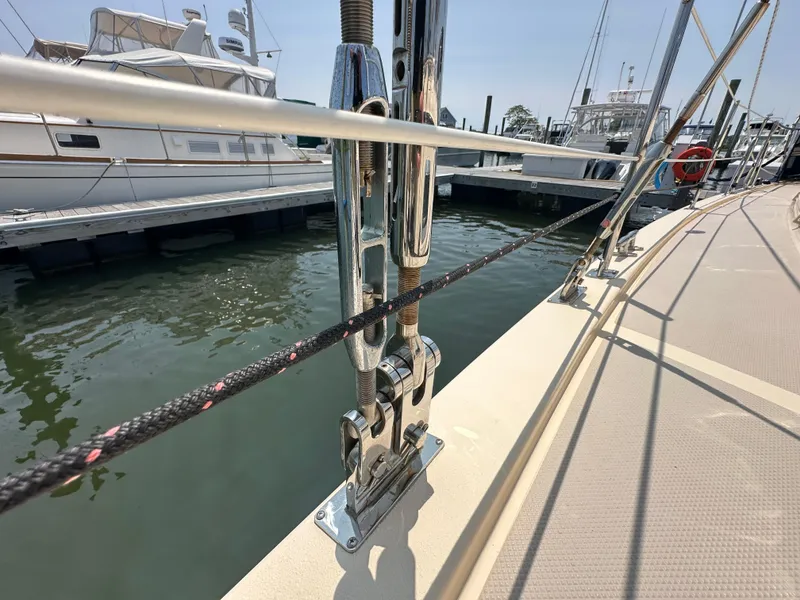 Slide: The Image of Close-up of Island Packet 439 sailboat rigging at a marina, 2021 model. - 14