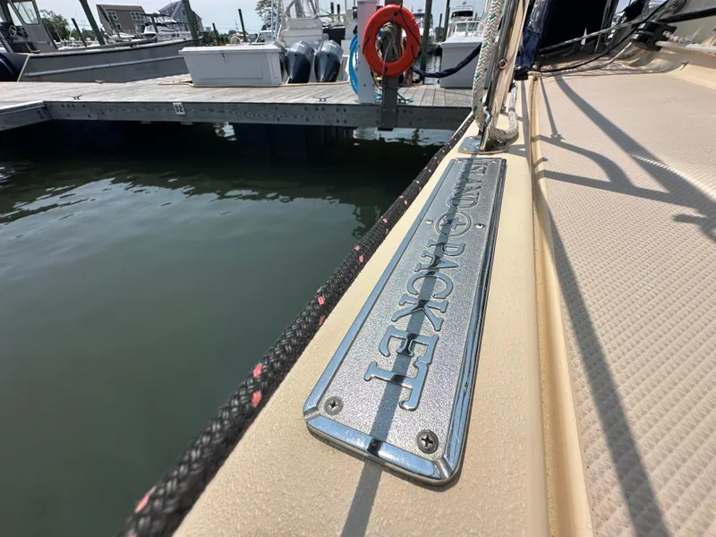 Slide: The Image of Island Packet 439 sailboat docked, showcasing brand nameplate, 2021 model. - 17