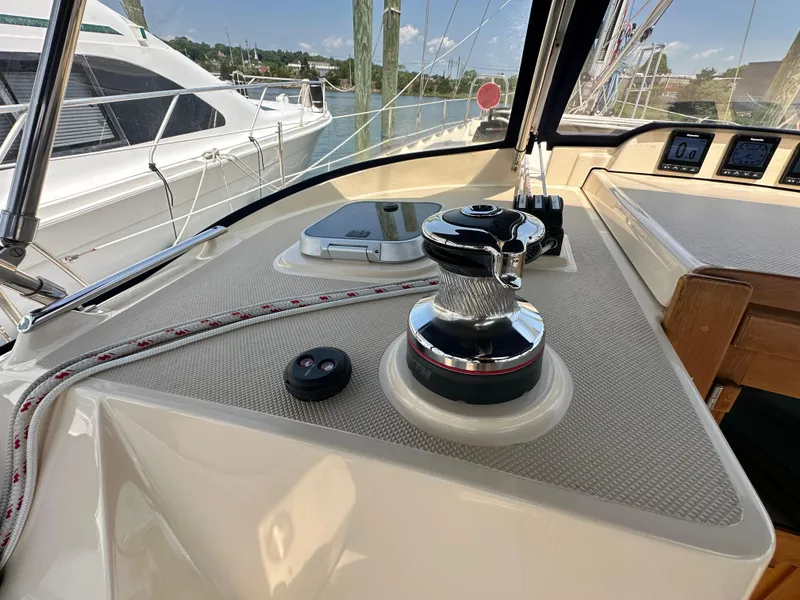 Slide: The Image of 2021 Island Packet 439 yacht deck with winch and control panel. - 27