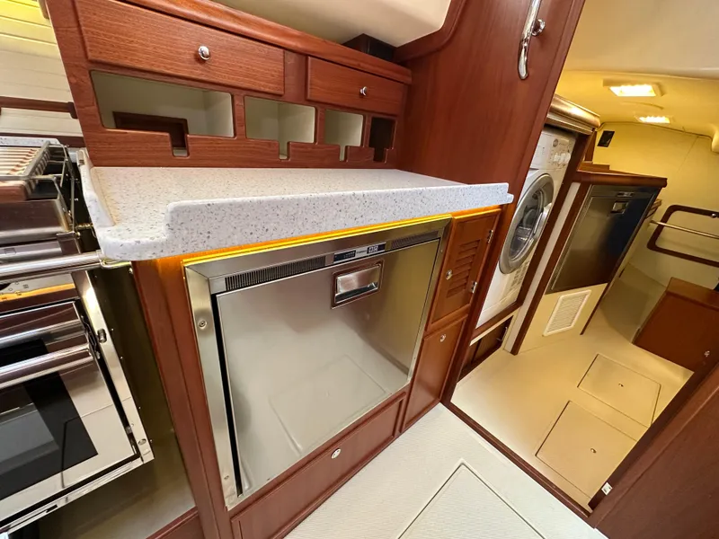 Slide: The Image of Luxurious interior of 2021 Island Packet 439 yacht with modern kitchen appliances. - 32