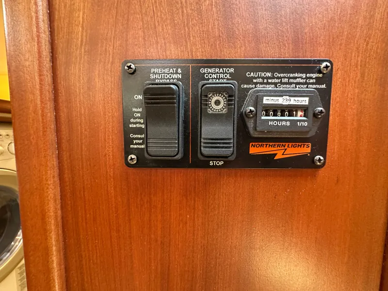 Slide: The Image of Control panel on 2021 Island Packet 439 yacht, featuring generator controls and hour meter. - 34