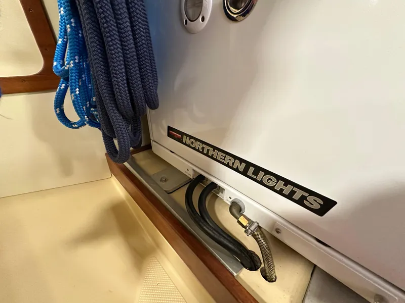 Slide: The Image of Coiled blue rope and Northern Lights generator on 2021 Island Packet 439 yacht. - 35