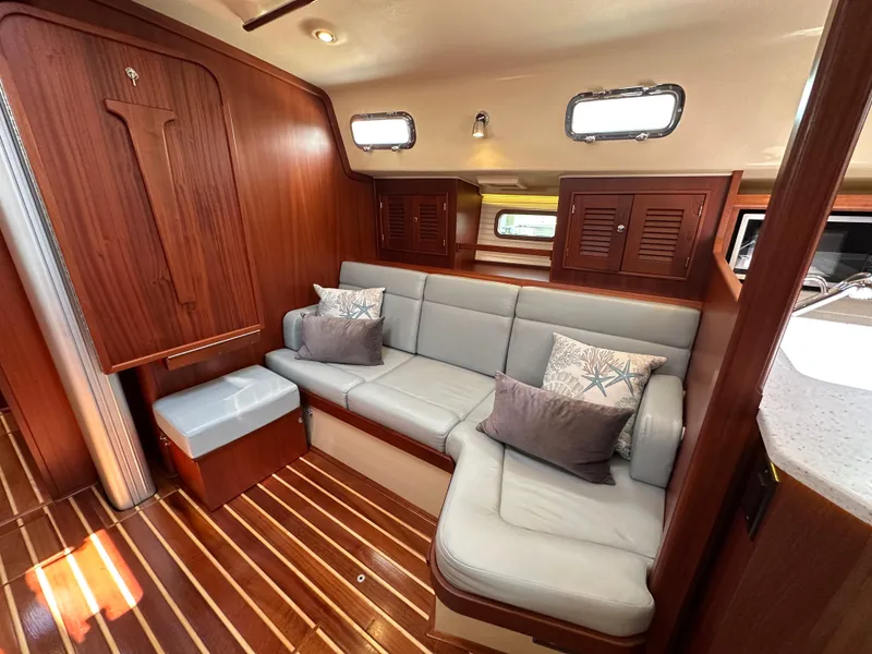 Slide: The Image of Luxurious interior of 2021 Island Packet 439 yacht with elegant wood finish and comfortable seating. - 38