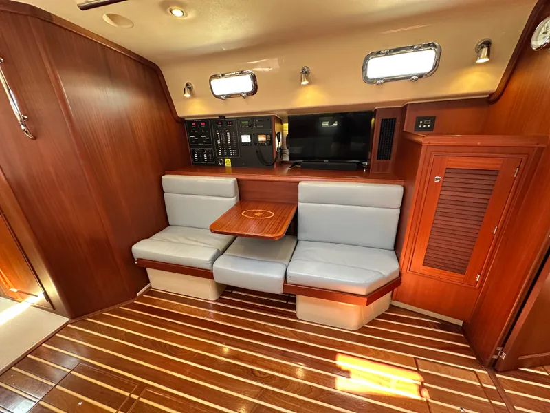 Slide: The Image of Luxurious interior of 2021 Island Packet 439 yacht with seating, table, and control panel. - 39