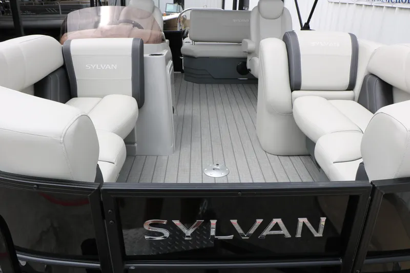 Slide: The Image of 2026 Sylvan Mirage Cruise 8520 CLZ DH pontoon boat interior with plush seating. - 14