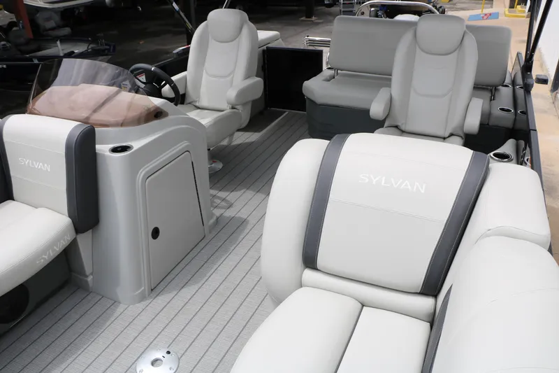 Slide: The Image of 2026 Sylvan Mirage Cruise 8520 CLZ DH interior with luxurious seating and modern design. - 16