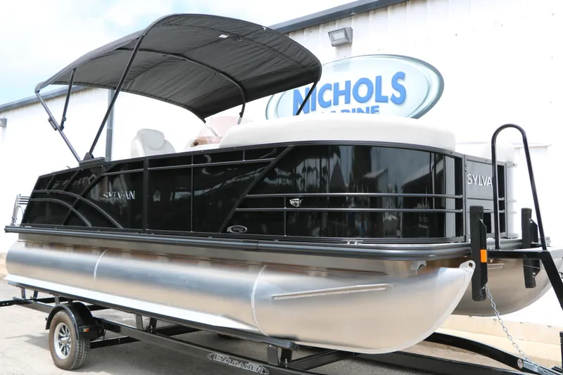 Slide: The Image of 2026 Sylvan Mirage Cruise 8520 CLZ DH pontoon boat on trailer, black exterior. - 2