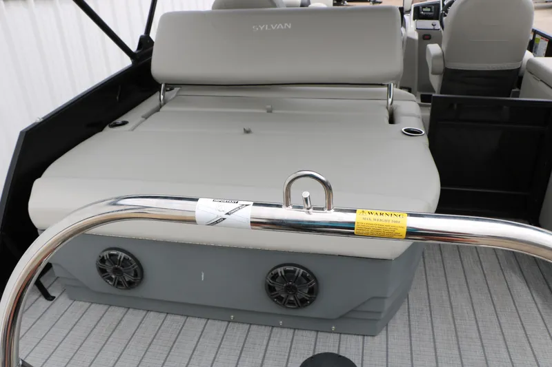 Slide: The Image of 2026 Sylvan Mirage Cruise 8520 CLZ DH interior with seating and speakers. - 20