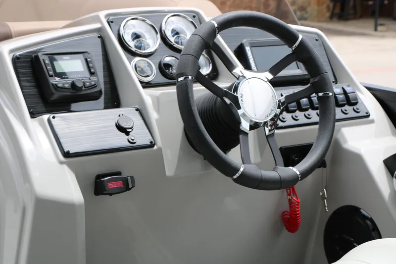 Slide: The Image of Steering console of 2026 Sylvan Mirage Cruise 8520 CLZ DH with modern controls and gauges. - 25