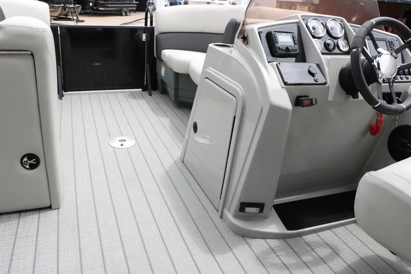 Slide: The Image of Interior view of 2026 Sylvan Mirage Cruise 8520 CLZ DH boat, featuring modern dashboard and seating. - 26