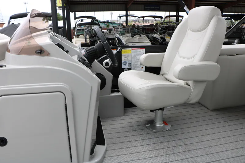 Slide: The Image of Captain's chair and helm of 2026 Sylvan Mirage Cruise 8520 CLZ DH pontoon boat. - 30