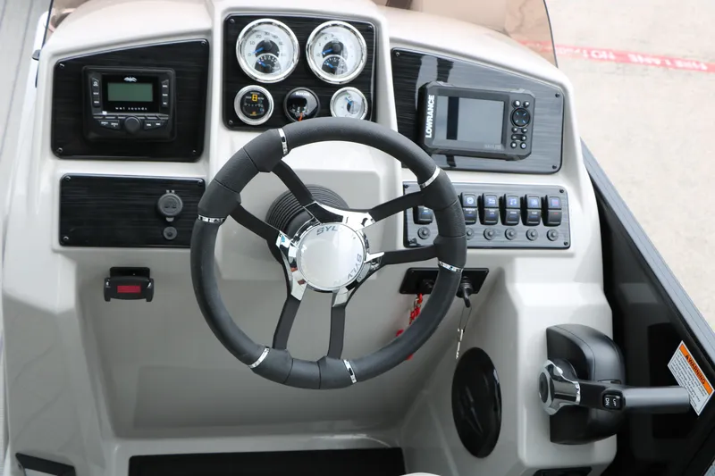 Slide: The Image of Steering console of 2026 Sylvan Mirage Cruise 8520 CLZ DH with modern controls and gauges. - 31