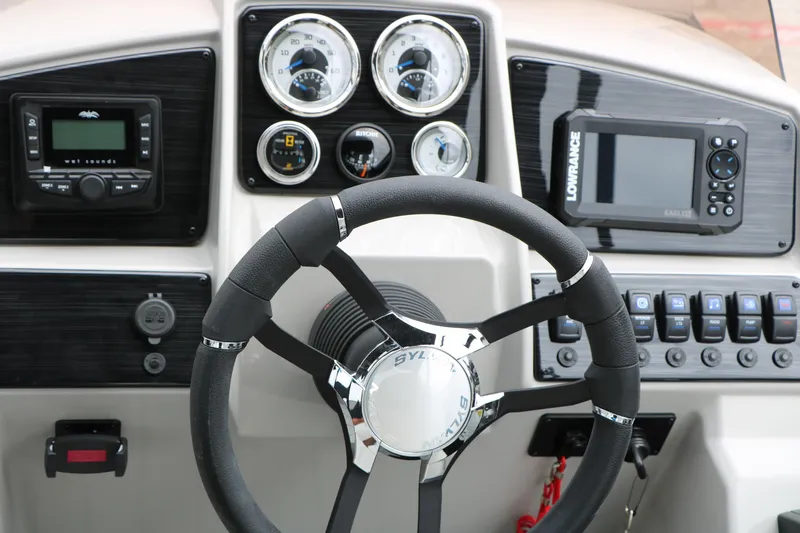 Slide: The Image of Steering console of 2026 Sylvan Mirage Cruise 8520 CLZ DH with gauges and controls. - 32