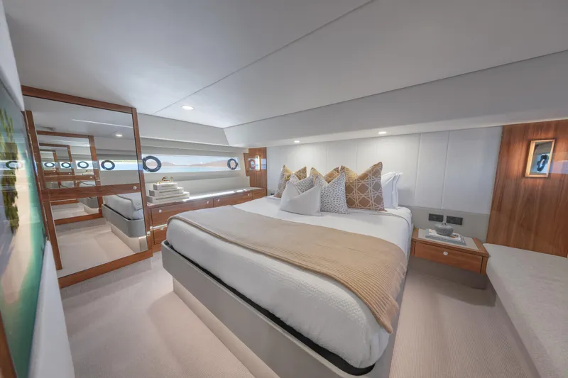 Slide: The Image of Luxurious bedroom interior of 2026 Maritimo M50 yacht, featuring elegant design and plush bedding. - 11