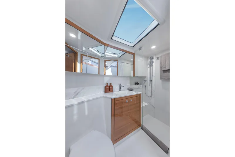 Slide: The Image of Luxurious bathroom interior of 2026 Maritimo M50 yacht with skylight and modern fixtures. - 14