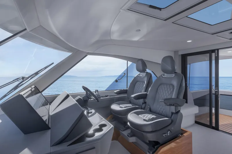 Slide: The Image of Interior of 2026 Maritimo M50 yacht with luxurious seating and ocean view. - 15