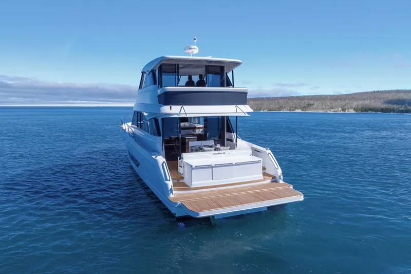 Slide: The Image of 2026 Maritimo M50 yacht cruising on open water, showcasing sleek design and spacious deck. - 2
