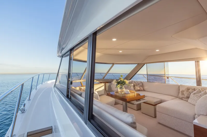 Slide: The Image of Luxurious interior of 2026 Maritimo M50 yacht with ocean view and elegant seating area. - 24