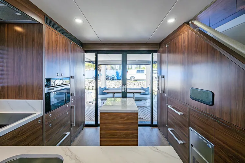 Slide: The Image of Luxurious interior of 2026 Maritimo M50 yacht with modern wood finishes and sleek design. - 26