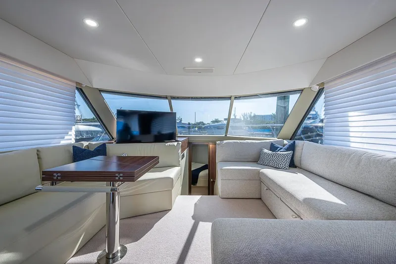 Slide: The Image of Luxurious interior of 2026 Maritimo M50 yacht with plush seating and panoramic windows. - 38