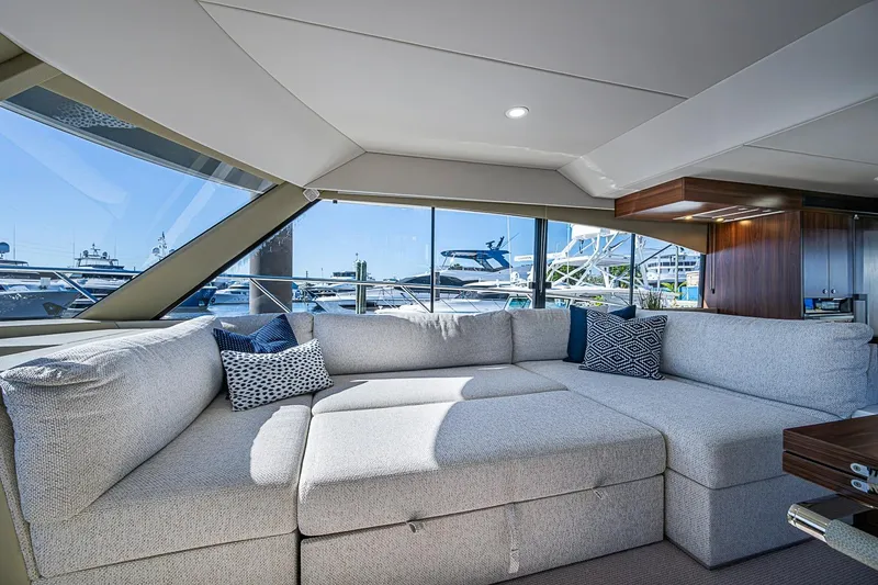 Slide: The Image of Luxurious interior of 2026 Maritimo M50 yacht with plush seating and marina view. - 40