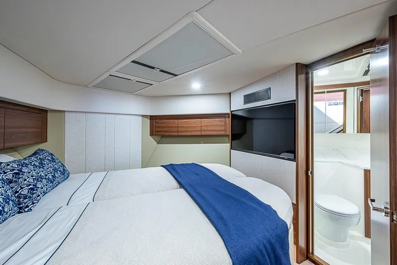 Slide: The Image of Luxurious cabin interior of 2026 Maritimo M50 yacht with twin beds and ensuite bathroom. - 44