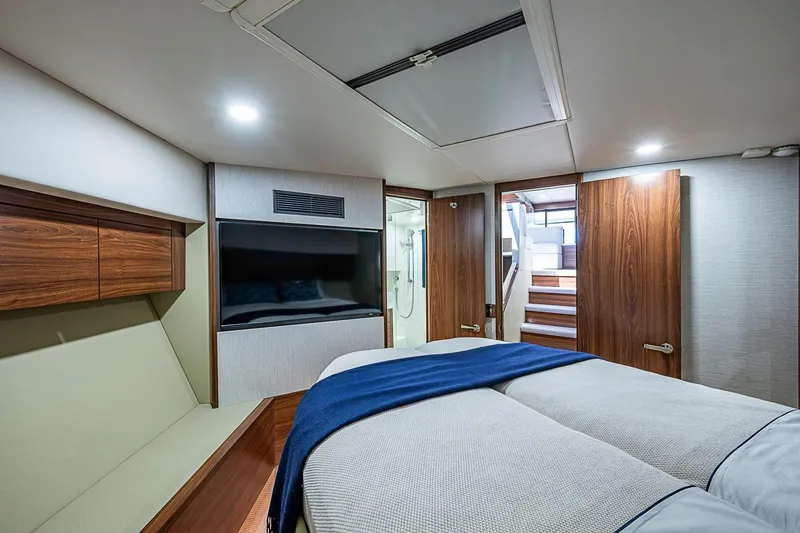Slide: The Image of Luxurious interior of 2026 Maritimo M50 yacht with modern design and cozy bedding. - 45