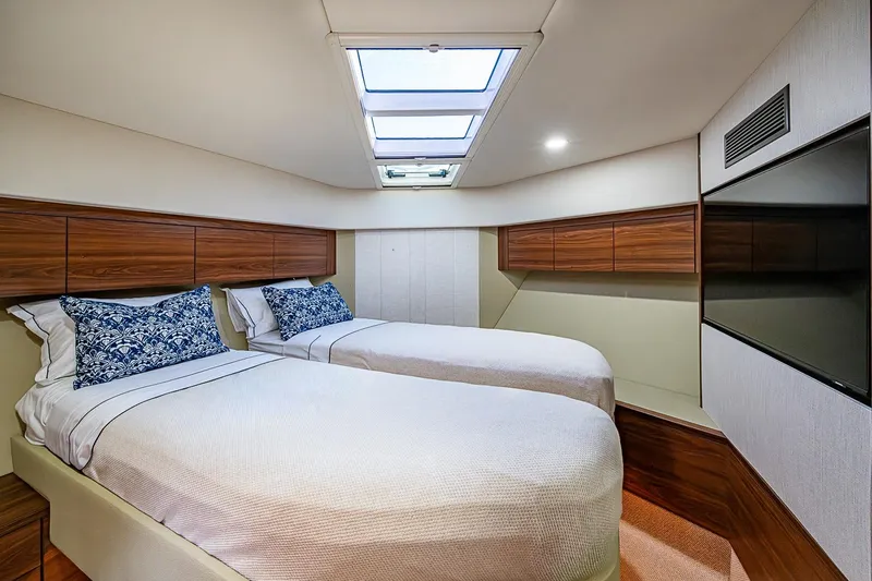 Slide: The Image of Luxurious twin cabin interior of 2026 Maritimo M50 yacht with skylight and wood accents. - 46
