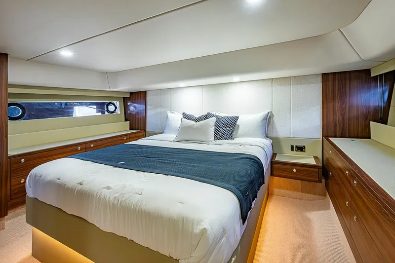 Slide: The Image of Luxurious bedroom interior of 2026 Maritimo M50 yacht with elegant wood finishes. - 55